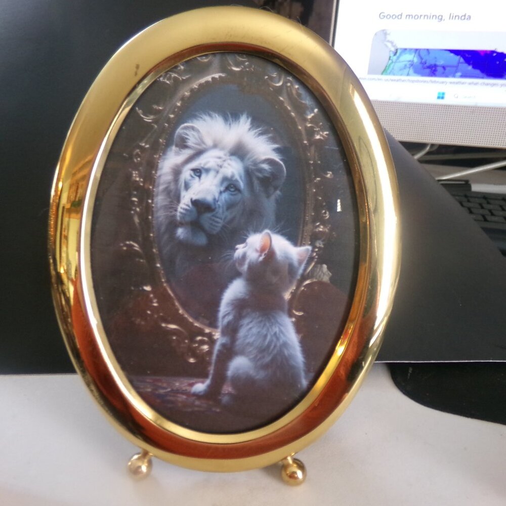 vintage brass oval frame.